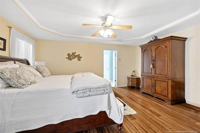 3313 Geyser Peak Rd, Fayetteville, NC 28306 - bedroom featuring a raised ceiling, wood finished floors, ornamental molding, and ceiling fan