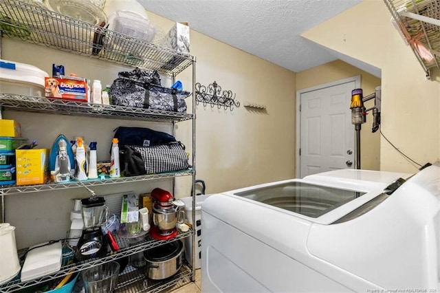 3313 Geyser Peak Rd, Fayetteville, NC 28306 - washroom featuring washer and clothes dryer and a textured ceiling