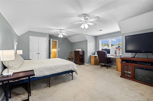 3313 Geyser Peak Rd, Fayetteville, NC 28306 - bedroom with a desk, vaulted ceiling, light colored carpet, ceiling fan, and a closet