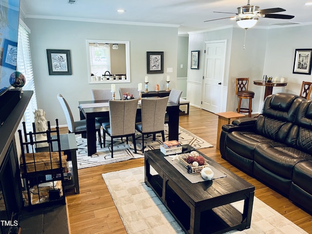 1507 Woodcroft Dr, Raleigh, NC 27609 - living room featuring a ceiling fan, light wood-style flooring, crown molding, and recessed lighting