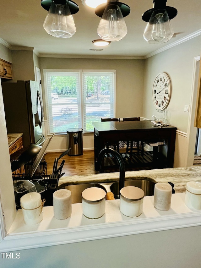 1507 Woodcroft Dr, Raleigh, NC 27609 - dining area featuring wood finished floors and ornamental molding