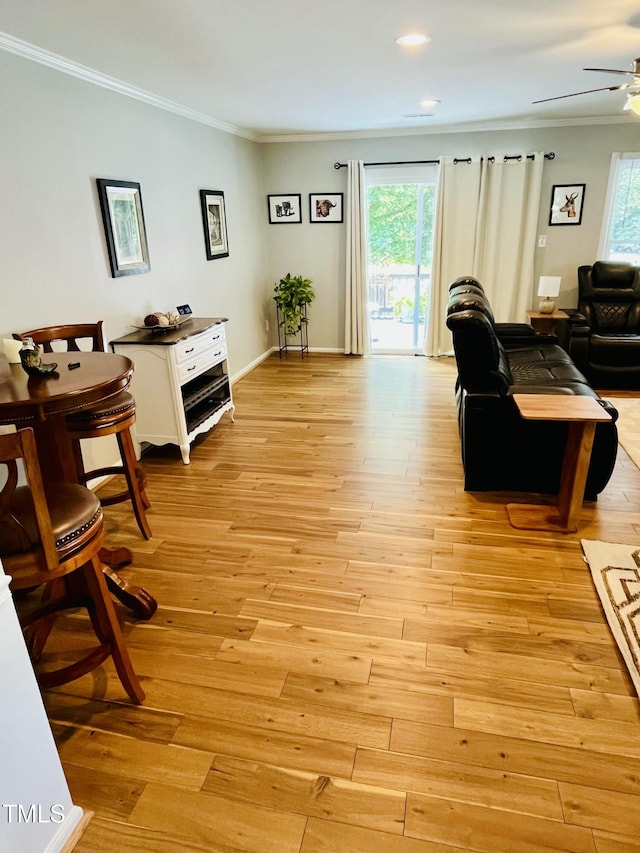 1507 Woodcroft Dr, Raleigh, NC 27609 - living room with crown molding, plenty of natural light, ceiling fan, light wood-style floors, and recessed lighting
