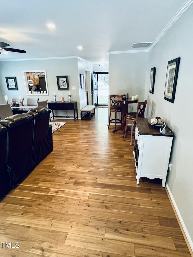 1507 Woodcroft Dr, Raleigh, NC 27609 - living room with ornamental molding, a ceiling fan, light wood-style floors, and recessed lighting