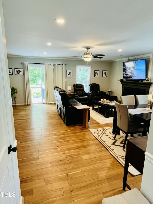 1507 Woodcroft Dr, Raleigh, NC 27609 - living area featuring recessed lighting, light wood-type flooring, ceiling fan, and crown molding