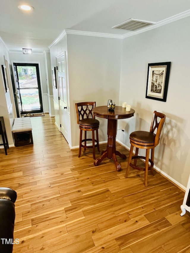 1507 Woodcroft Dr, Raleigh, NC 27609 - dining room featuring crown molding, light wood-type flooring, and recessed lighting