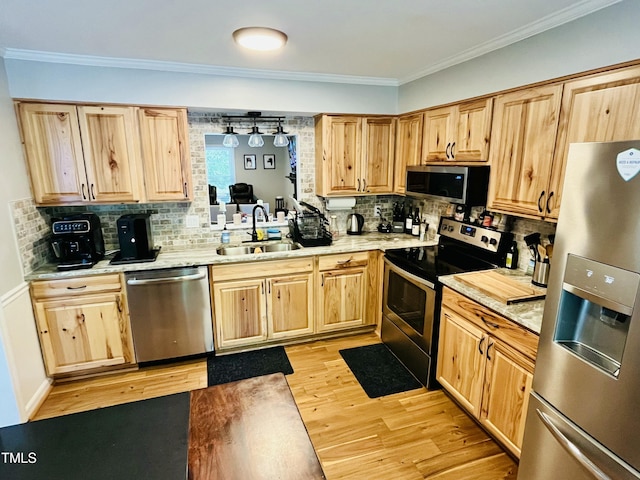 1507 Woodcroft Dr, Raleigh, NC 27609 - kitchen with stainless steel appliances, light brown cabinets, light countertops, and ornamental molding