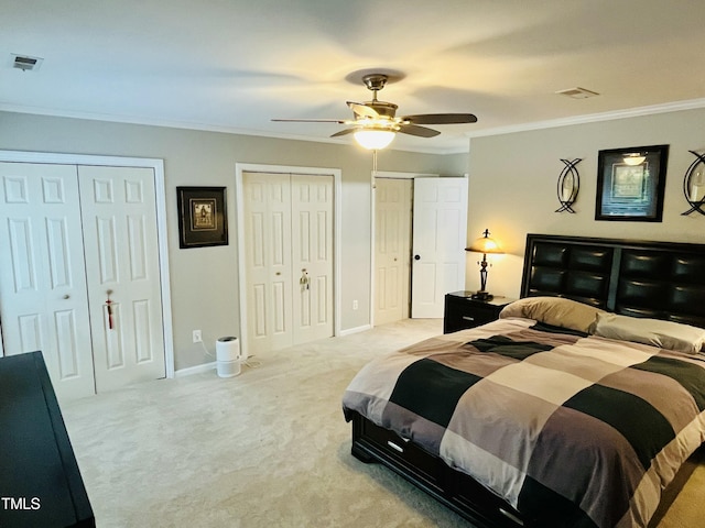 1507 Woodcroft Dr, Raleigh, NC 27609 - bedroom with crown molding, multiple closets, carpet floors, and ceiling fan