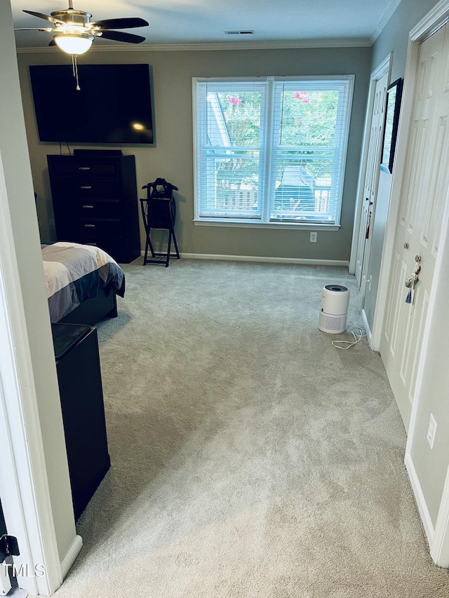 1507 Woodcroft Dr, Raleigh, NC 27609 - bedroom with ornamental molding, multiple closets, carpet floors, and a ceiling fan