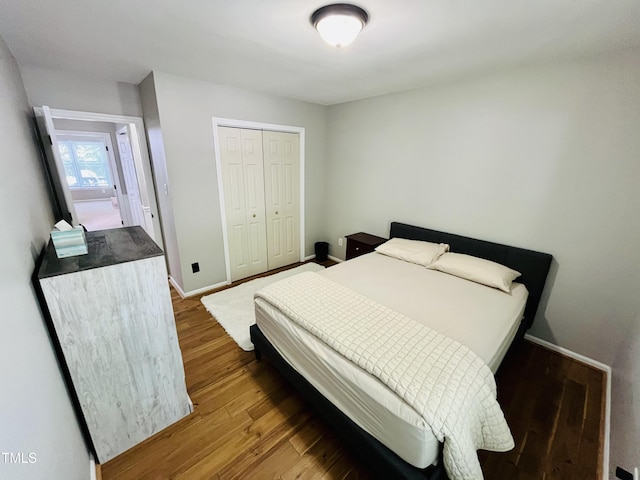 1507 Woodcroft Dr, Raleigh, NC 27609 - bedroom featuring wood finished floors and a closet
