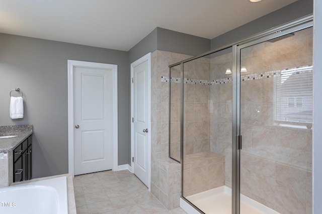 3913 Chapel Oak Dr, Apex, NC 27502 - bathroom featuring a stall shower, vanity, a tub, and tile patterned flooring