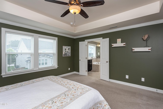 3913 Chapel Oak Dr, Apex, NC 27502 - bedroom with light carpet, ornamental molding, ensuite bath, a tray ceiling, and ceiling fan