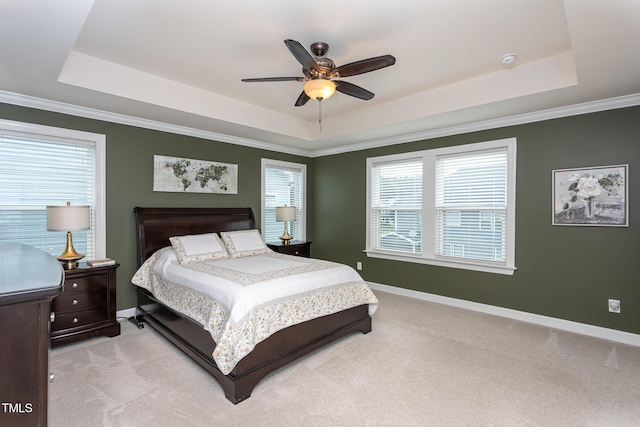 3913 Chapel Oak Dr, Apex, NC 27502 - bedroom with a tray ceiling, light colored carpet, multiple windows, a ceiling fan, and crown molding