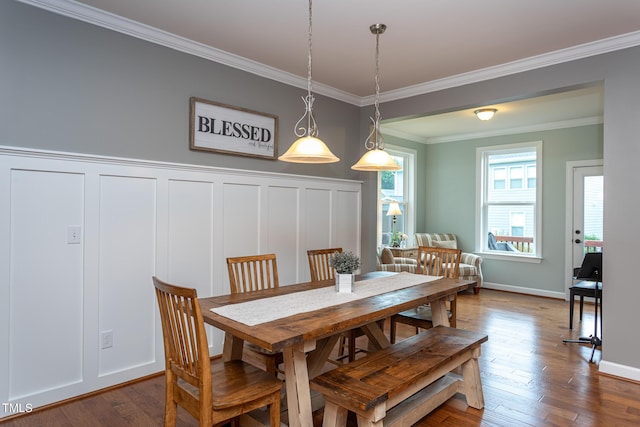 3913 Chapel Oak Dr, Apex, NC 27502 - dining area with ornamental molding, dark wood-style flooring, a decorative wall, and wainscoting