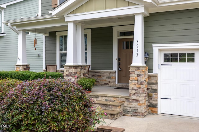 3913 Chapel Oak Dr, Apex, NC 27502 - property entrance featuring a porch, board and batten siding, and stone siding
