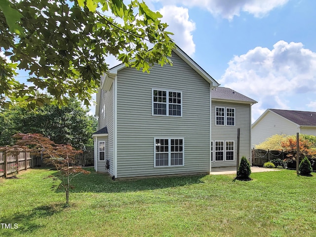 709 Pyracantha Dr, Holly Springs, NC 27540 - rear view of property with a fenced backyard
