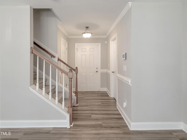 709 Pyracantha Dr, Holly Springs, NC 27540 - foyer with wood finished floors, ornamental molding, and stairway