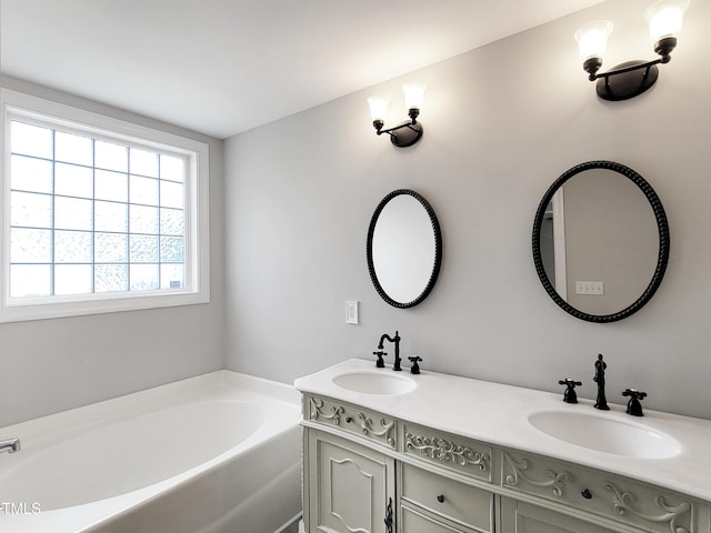 709 Pyracantha Dr, Holly Springs, NC 27540 - bathroom with double vanity and a garden tub