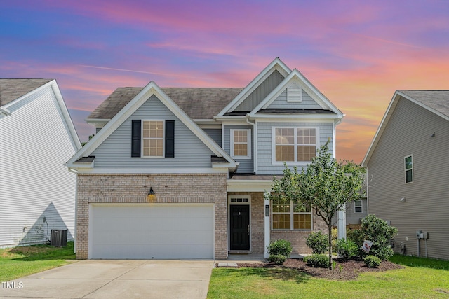 637 Stapleford Ln, Fuquay Varina, NC 27526 - view of front of home featuring concrete driveway, brick siding, and a garage
