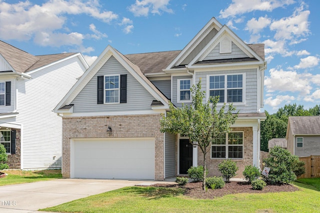 637 Stapleford Ln, Fuquay Varina, NC 27526 - view of front of home with brick siding, driveway, and a garage
