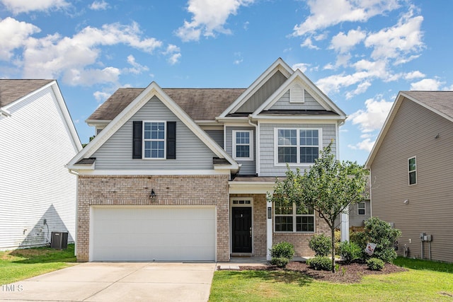 637 Stapleford Ln, Fuquay Varina, NC 27526 - craftsman house with concrete driveway, brick siding, a garage, and roof with shingles