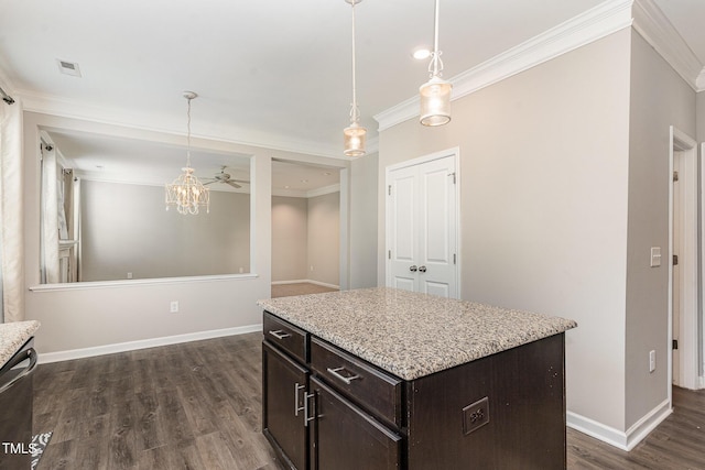 637 Stapleford Ln, Fuquay Varina, NC 27526 - kitchen featuring ornamental molding, dark brown cabinets, dark wood finished floors, a chandelier, and pendant lighting