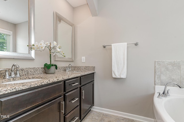 637 Stapleford Ln, Fuquay Varina, NC 27526 - bathroom with double vanity and a garden tub