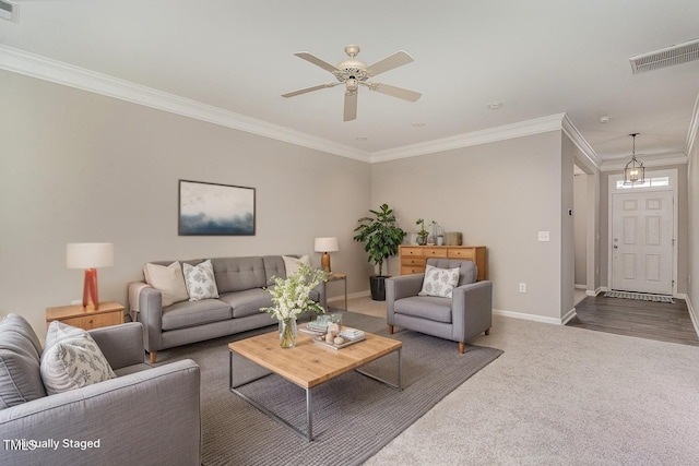 637 Stapleford Ln, Fuquay Varina, NC 27526 - carpeted living room with crown molding and a ceiling fan