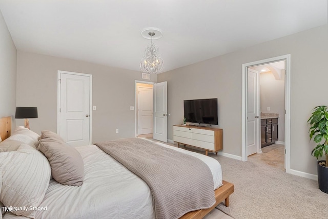 637 Stapleford Ln, Fuquay Varina, NC 27526 - bedroom featuring a chandelier, light colored carpet, and ensuite bathroom