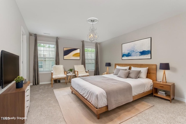 637 Stapleford Ln, Fuquay Varina, NC 27526 - bedroom with light colored carpet and a chandelier