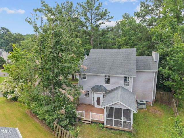 2763 Garland Ct, Creedmoor, NC 27522 - rear view of property with a sunroom, a chimney, a deck, and roof with shingles