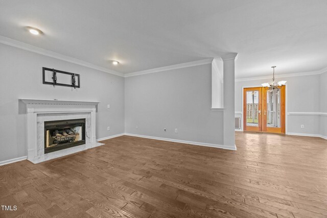 2763 Garland Ct, Creedmoor, NC 27522 - unfurnished living room featuring a chandelier, wood finished floors, ornamental molding, and a fireplace