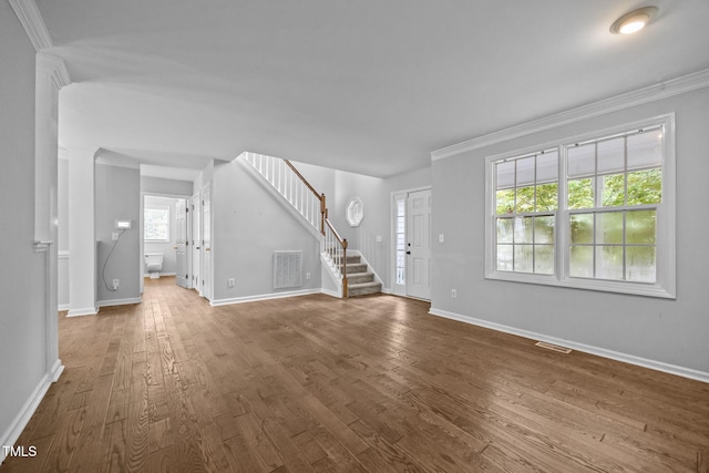 2763 Garland Ct, Creedmoor, NC 27522 - unfurnished living room featuring stairs, crown molding, and wood finished floors