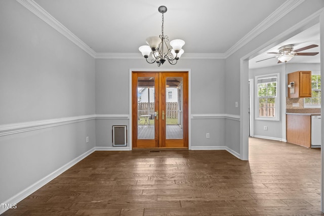 2763 Garland Ct, Creedmoor, NC 27522 - unfurnished dining area with french doors, a chandelier, dark wood-style flooring, crown molding, and ceiling fan