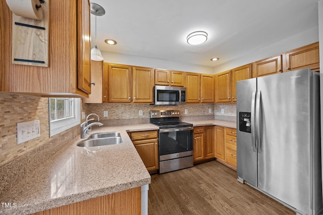2763 Garland Ct, Creedmoor, NC 27522 - kitchen with appliances with stainless steel finishes, backsplash, dark wood finished floors, pendant lighting, and recessed lighting