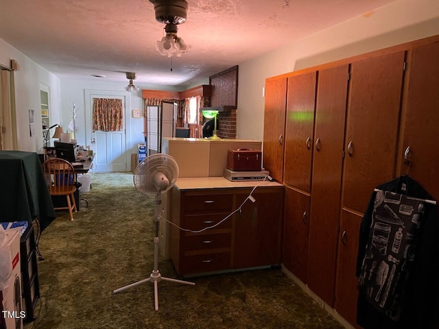 904-906 Mckay Ave, Dunn, NC 28334 - kitchen with dark carpet, light countertops, and a peninsula