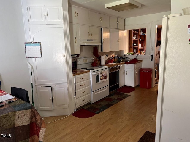 904-906 Mckay Ave, Dunn, NC 28334 - kitchen featuring white appliances, under cabinet range hood, and white cabinets