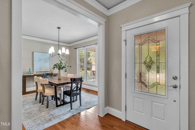 4324 Brighton Ridge Dr, Apex, NC 27539 - foyer entrance featuring wood finished floors, crown molding, and a chandelier