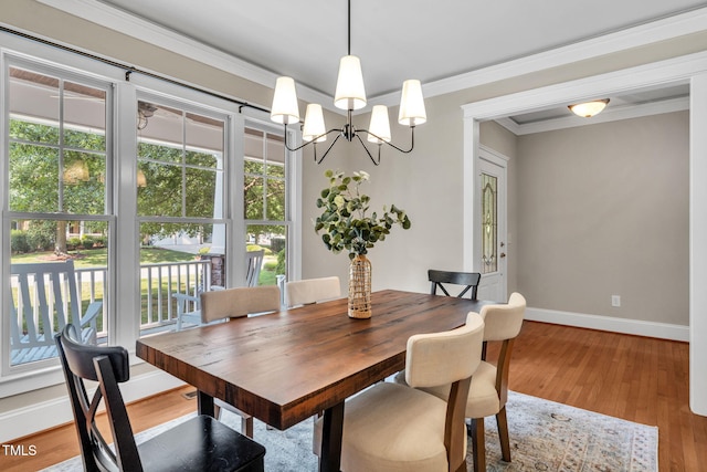 4324 Brighton Ridge Dr, Apex, NC 27539 - dining area featuring healthy amount of natural light, ornamental molding, a chandelier, and wood finished floors
