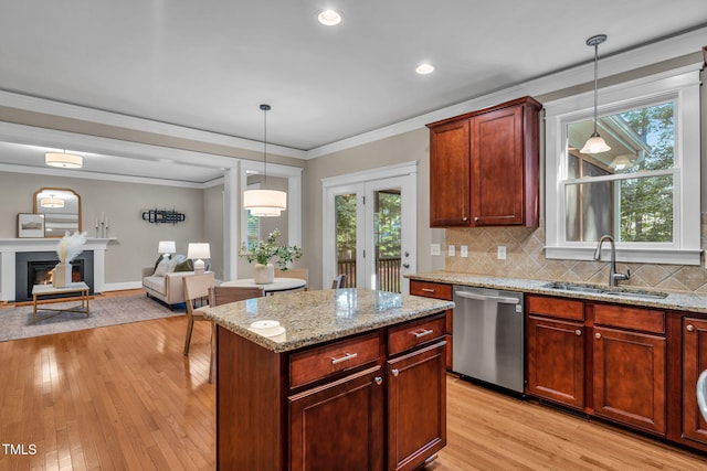 4324 Brighton Ridge Dr, Apex, NC 27539 - kitchen with dishwasher, light wood-type flooring, healthy amount of natural light, decorative backsplash, and crown molding
