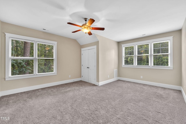 4324 Brighton Ridge Dr, Apex, NC 27539 - unfurnished bedroom with multiple windows, carpet floors, a ceiling fan, and a closet