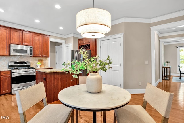 4324 Brighton Ridge Dr, Apex, NC 27539 - kitchen featuring stainless steel appliances, ornamental molding, backsplash, light wood finished floors, and recessed lighting