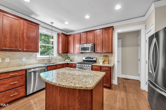 4324 Brighton Ridge Dr, Apex, NC 27539 - kitchen featuring stainless steel appliances, light wood finished floors, light stone counters, crown molding, and recessed lighting