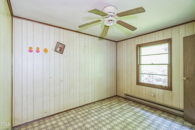 1141 Morgan Rd, Henderson, NC 27537 - empty room with a baseboard radiator, tile patterned floors, wood walls, and ceiling fan