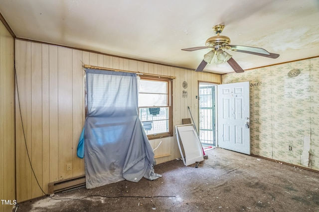 1141 Morgan Rd, Henderson, NC 27537 - foyer featuring a ceiling fan, a baseboard heating unit, and wood walls