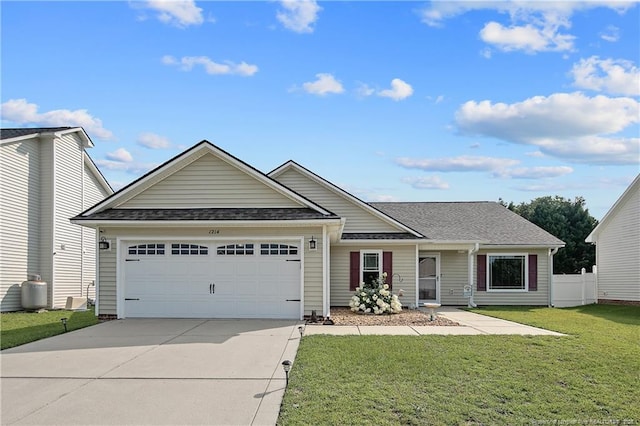 1214 Herring Gull Dr, Fayetteville, NC 28306 - view of front of house with driveway, an attached garage, and a shingled roof