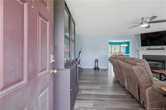 1214 Herring Gull Dr, Fayetteville, NC 28306 - foyer with a ceiling fan, wood finished floors, a fireplace, and a chandelier