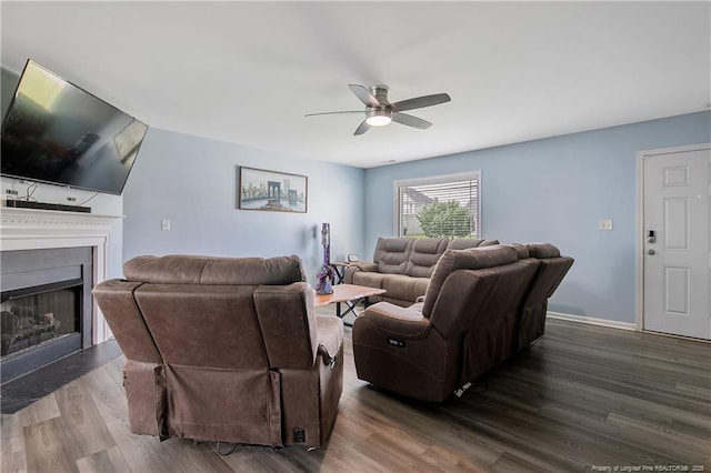 1214 Herring Gull Dr, Fayetteville, NC 28306 - living area featuring ceiling fan, wood finished floors, and a fireplace with raised hearth
