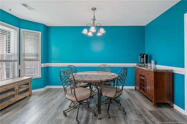 1214 Herring Gull Dr, Fayetteville, NC 28306 - dining space with a chandelier and wood finished floors