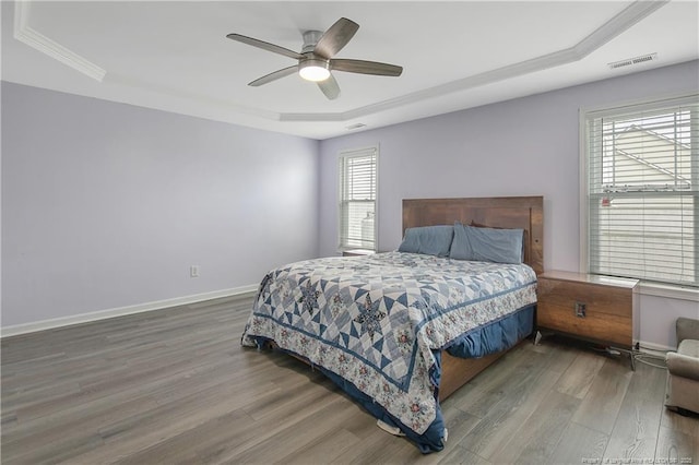 1214 Herring Gull Dr, Fayetteville, NC 28306 - bedroom with a tray ceiling, wood finished floors, ceiling fan, and ornamental molding