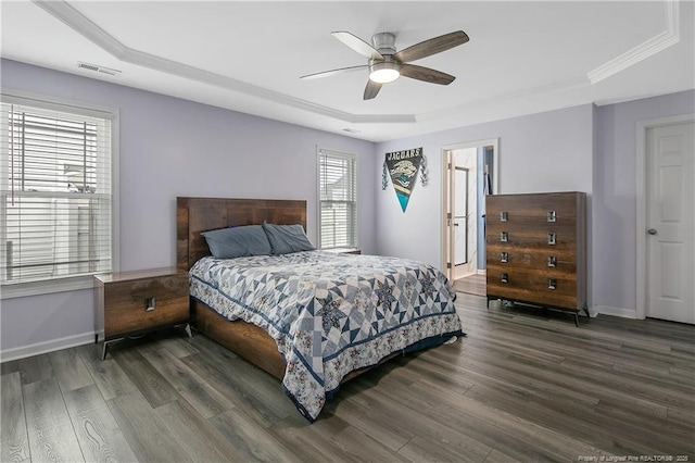 1214 Herring Gull Dr, Fayetteville, NC 28306 - bedroom with a raised ceiling, multiple windows, wood finished floors, and crown molding